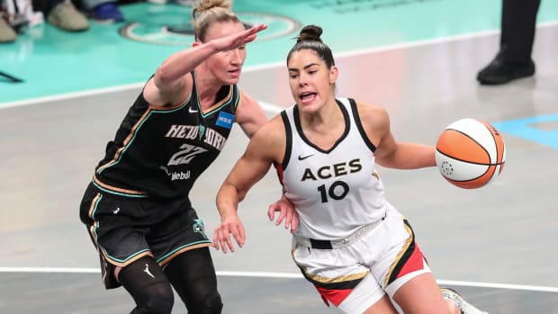 Las Vegas Aces guard Kelsey Plum drives around New York Liberty guard Courtney Vandersloot in the WNBA Finals.